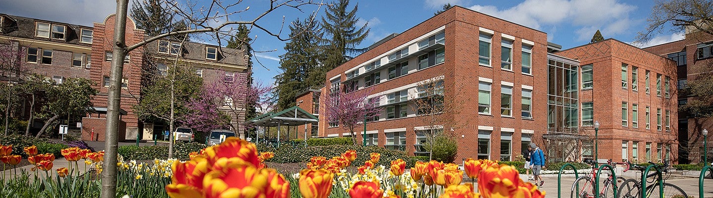 Allen Hall exterior framed by flowers