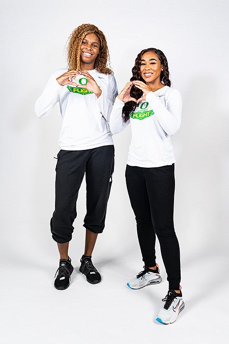 Ruthy Hebard and Minyon Moore throw their Oregon Os