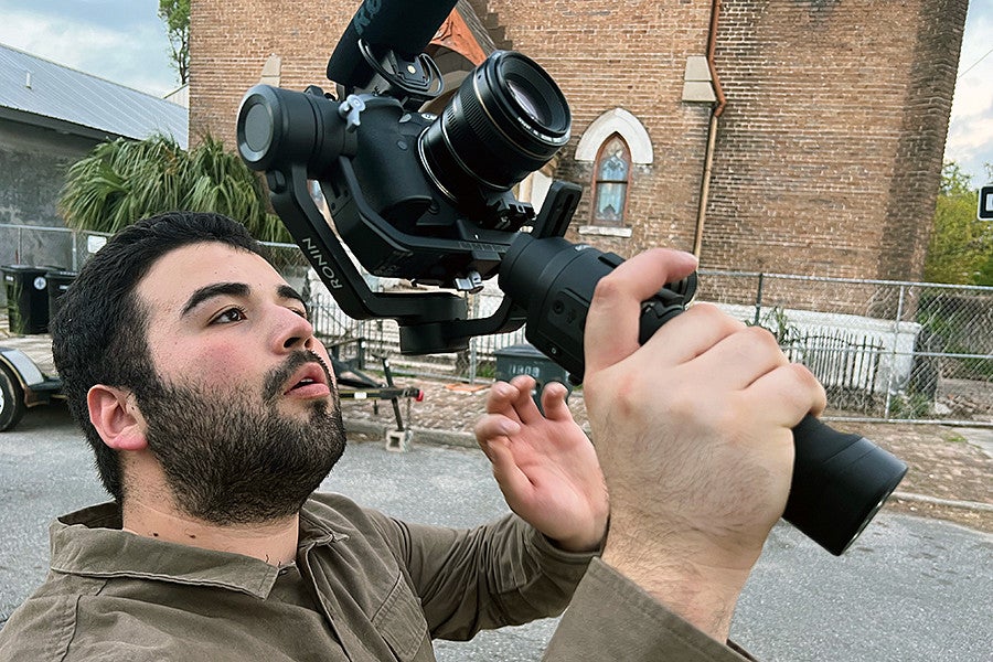 Canden Gutierrez gathering B-roll of the neighborhood the team was based out of.