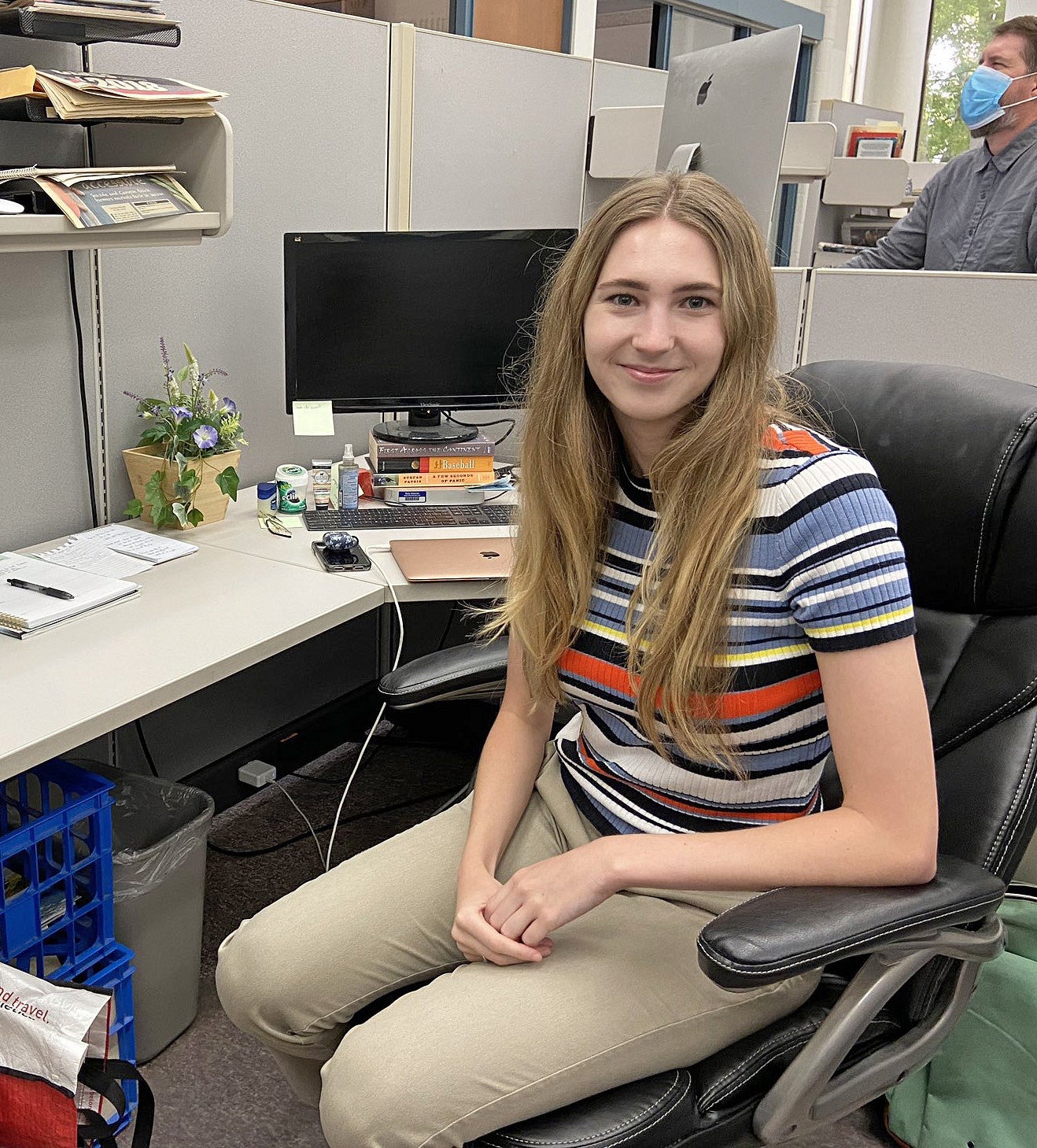 Alexis Weisend in a cubicle work station