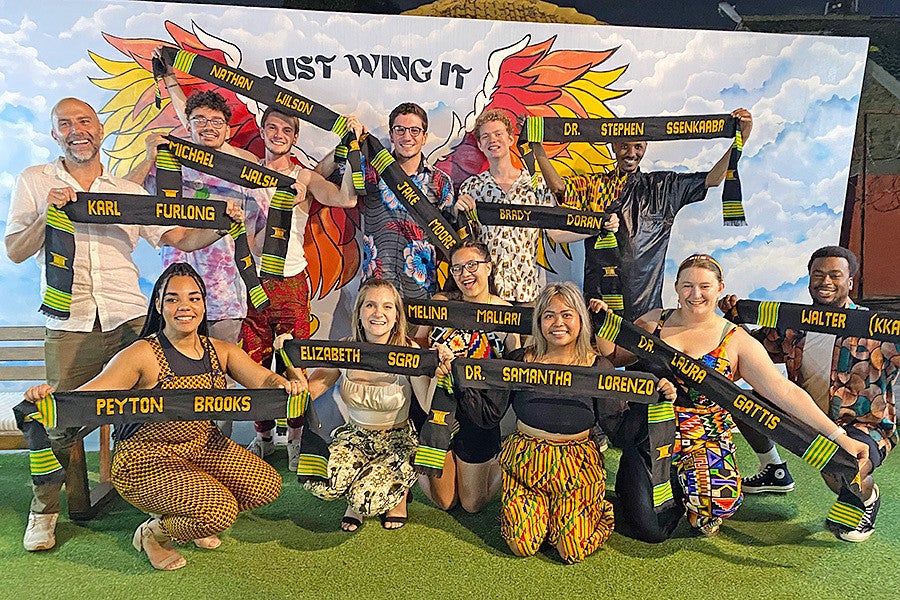 students on the Media in Ghana trip pose with custom woven sashes