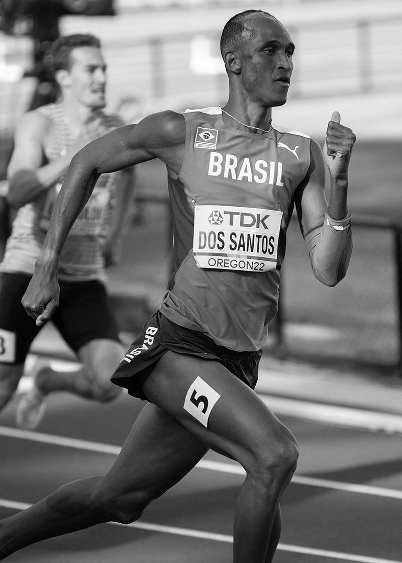 black and white image of Brazilian athlete Alison dos Santos competing during the World Athletic Championships in July 2022. Photo by Chloe Montague
