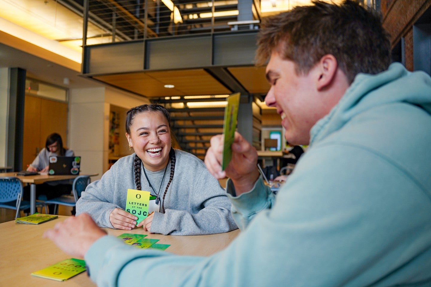 Sydney Seymour and a friend play SOJC Letters, a game she created for her Media Studies production class