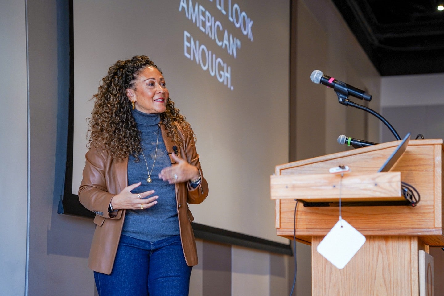 Michele Norris speaks from behind a podium at the University of Oregon School of Journalism and Communication