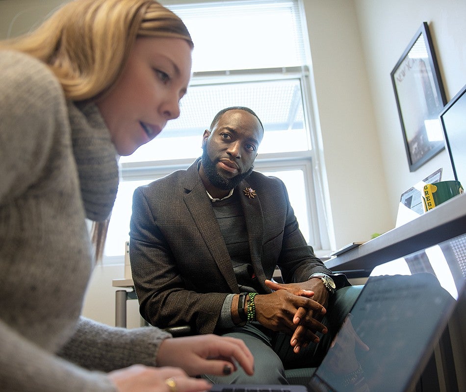 School of Journalism and Communication Professor Troy Elias and graduate student Dani Clarke