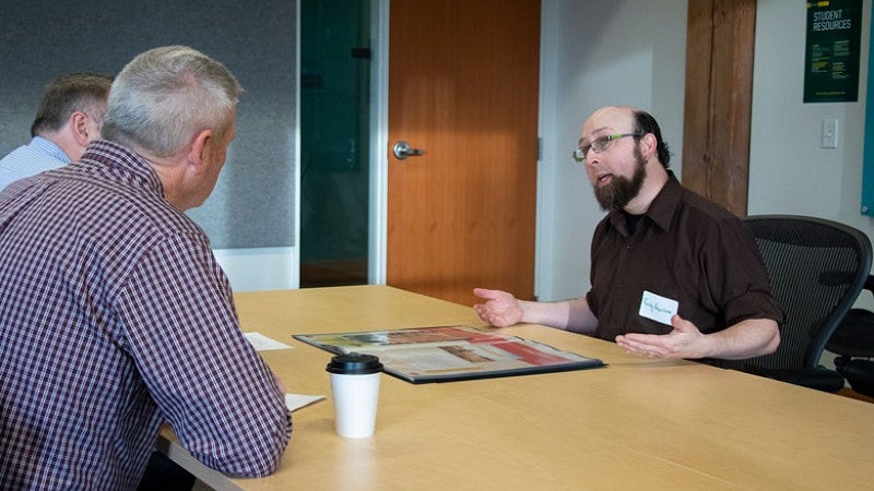 Randy Newnham during SOJC portfolio review on the UO Portland campus. 