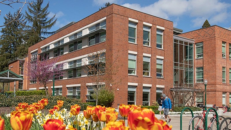 Allen Hall exterior framed by flowers