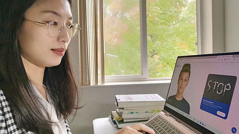 Tingyou Zou works at a laptop