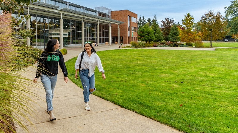 two students walk on the University of Oregon Portland campus