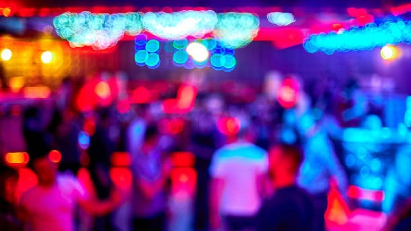 out of focus photo of a party with colorful lighting