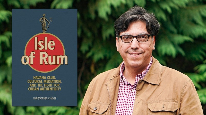 a portrait of Christopher Chavez with the cover of his book, Isle of Rum, digitally superimposed