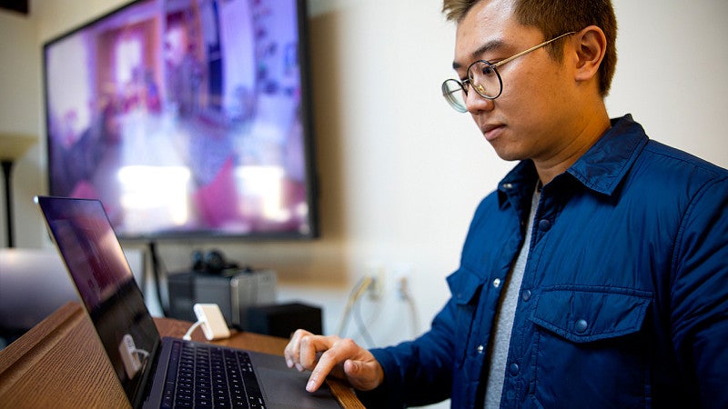 Student using their laptop.