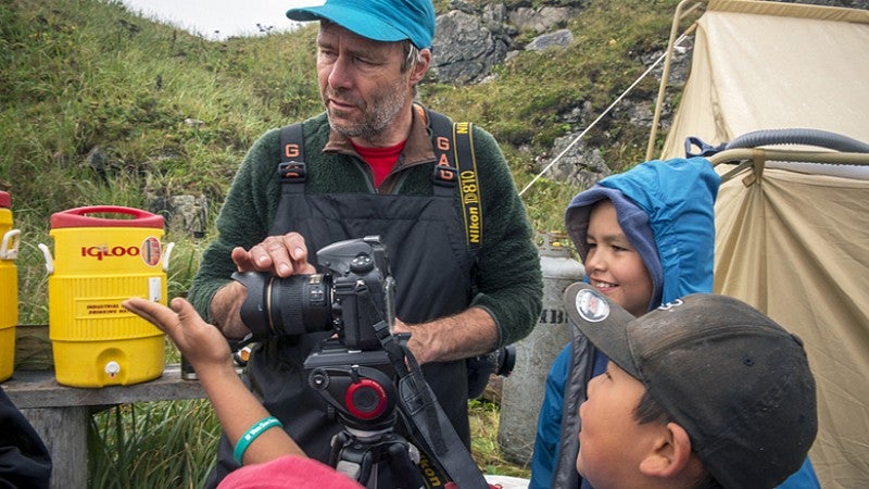 SOJC Professor of Practice Torsten Kjellstrand holding camera.