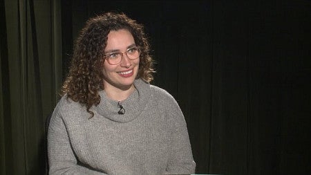 Professor Alex Segrè Cohen seated for an interview