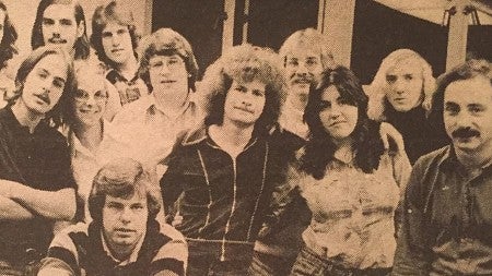sepia toned image of Randy Shilts and fellow students in the 1970s