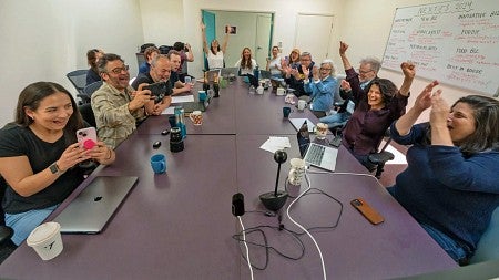 staff of Lookout Santa Cruz celebrate their Pulitzer award