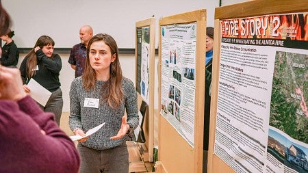 Eden McCall presents her science communication research project poster titled The Fire Story 2