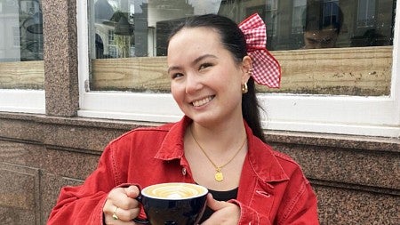 Rebecca Chiang poses with a latte 