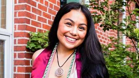 senior portrait of Sydney Seymour with the Allen Hall sign