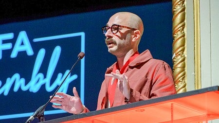 John D Sutter speaks at a podium