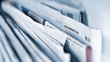 Photo of newspaper lined together.