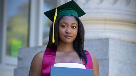 Makayla Agnew poses with her diploma from the University of Oregon