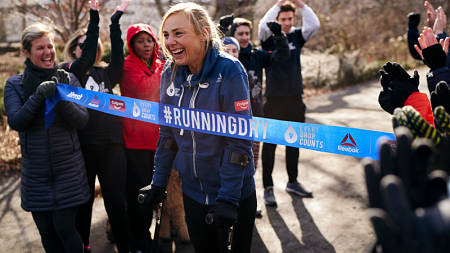 Mina Guli crossing the finish line