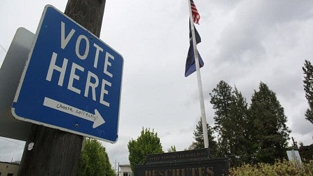 Vote here sign in front of polling location.