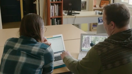 Two students discussing a research project.
