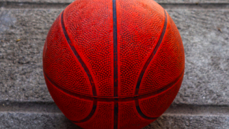 Orange basketball on concrete