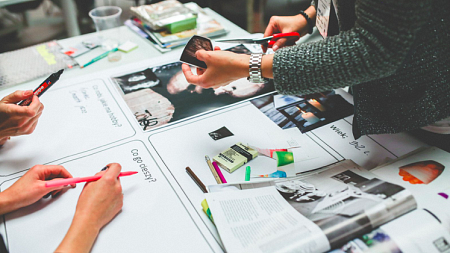 People work together on an advertising project.