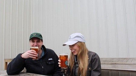 Two people drinking beer