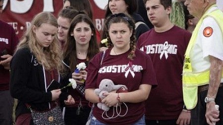 Students standing outside of school after shooting 