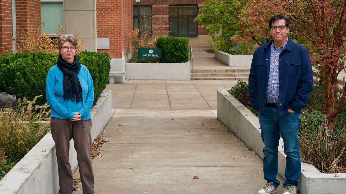 Gabriela Martinez and Chris Chavez stand outside of Allen Hall