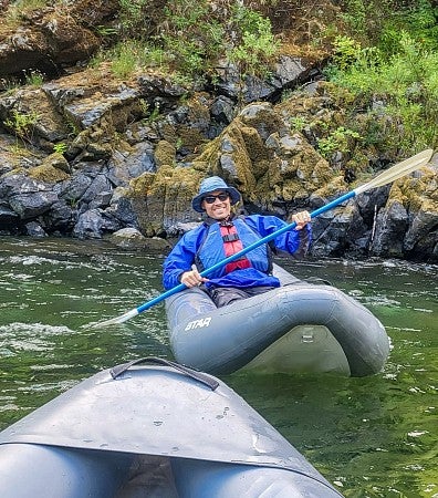 Ivan Miller paddles a kayak