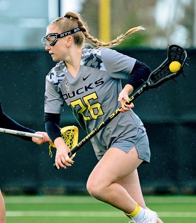 Bailey Smith playing lacrosse for UO