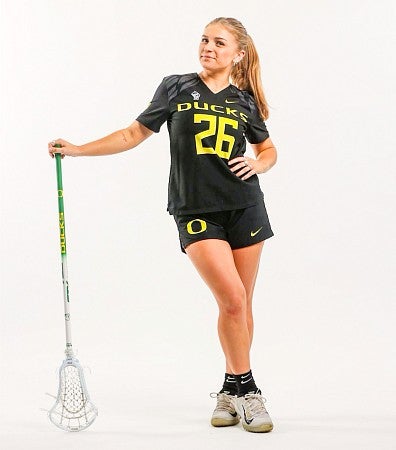 Bailey Smith poses in her UO lacrosse uniform