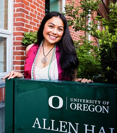 senior portrait of Sydney Seymour with the Allen Hall sign