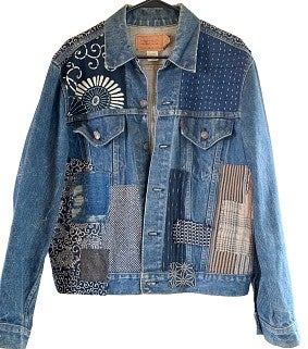 denim jacket with patchwork pieces of japanese boro fabric